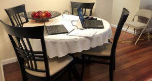 Using home office organizing strategies to set up dining table as temporary home office