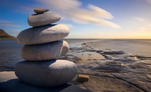 work life harmony stones on beach